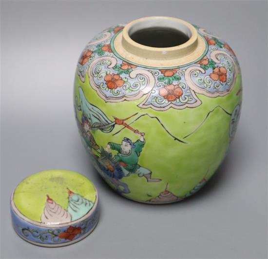 A Chinese lime green ground famille verte jar and cover, late 19th century, 15cm